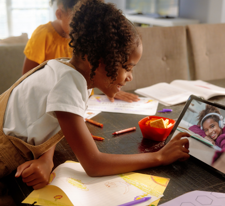 A girl and her friend are talking to each other by video call on tablet powered by Brightspeed Internet.